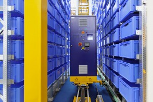 Automated storage warehouse with blue plastic crates